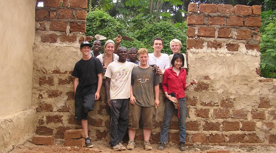 Volunteers take a photo near their building work on the Projects Abroad service learning trip to Ghana for middle school students. Volunteers take a photo by their building work on the service learning project in Ghana for middle school students.